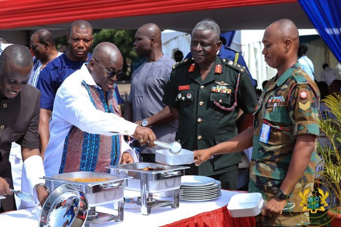 Nana-Addo-serving-food-at-Burma-Camp-696x464.jpg