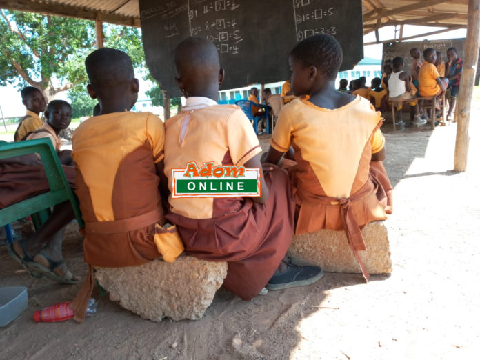 students sit on block students sit on block