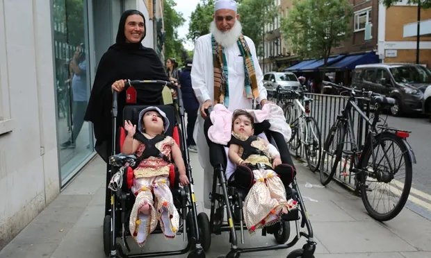 Safa and Marwa Ullah leave hospital with their mother and their grandfather. Photograph: Great Ormond Street Hospital/PA Safa and Marwa Ullah leave hospital with their mother and their grandfather. Photograph: Great Ormond Street Hospital/PA