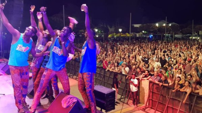 FRA! band on stage taking a selfie with the crowd