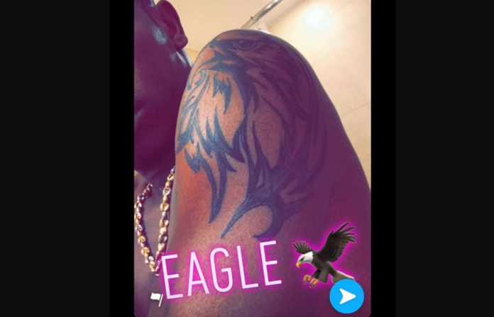 Shatta Wale shows off tattoo