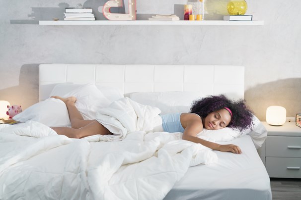 woman sleeping on a bed woman sleeping on a bed