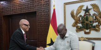 President Akufo-Addo receiving the report from Justice Emile Short