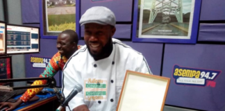 Enoch Kwesi Worlanyo displaying his award