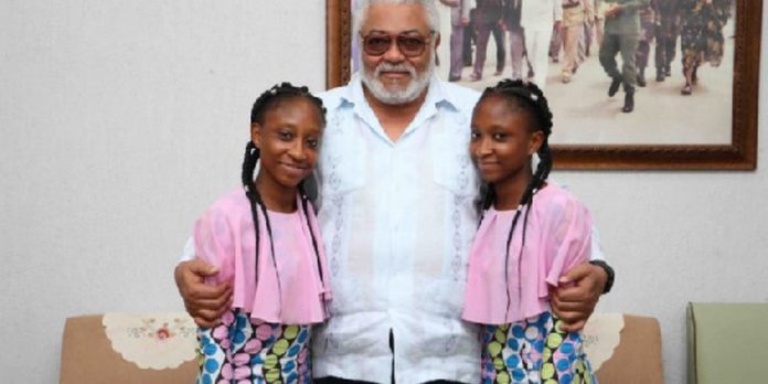 The twins in a photograph with former President John Rawlings The twins in a photograph with former President John Rawlings