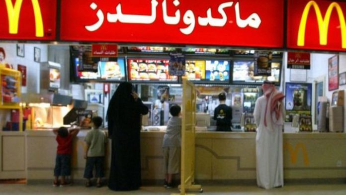 A segregation board separates women and families from men at a McDonalds restaurant in Riyadh(Copy) A segregation board separates women and families from men at a McDonalds restaurant in Riyadh