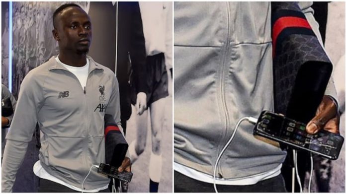 For a player, who according to The Guardian, earns £150,000 per week in the Premier League, it is extremely strange to see him carrying around an iPhone with a broken screen guard. For a player, who according to The Guardian, earns £150,000 per week in the Premier League, it is extremely strange to see him carrying around an iPhone with a broken screen guard.