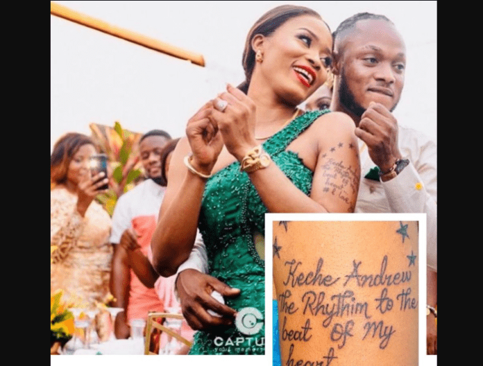 Keche Andrew's wife tattoos singer's name on her hand Keche Andrew's wife tattoos singer's name on her hand