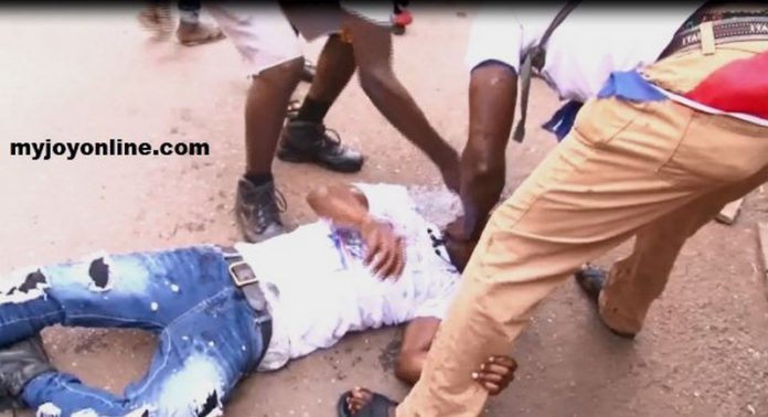 An injured man being attended to. An injured man being attended to.