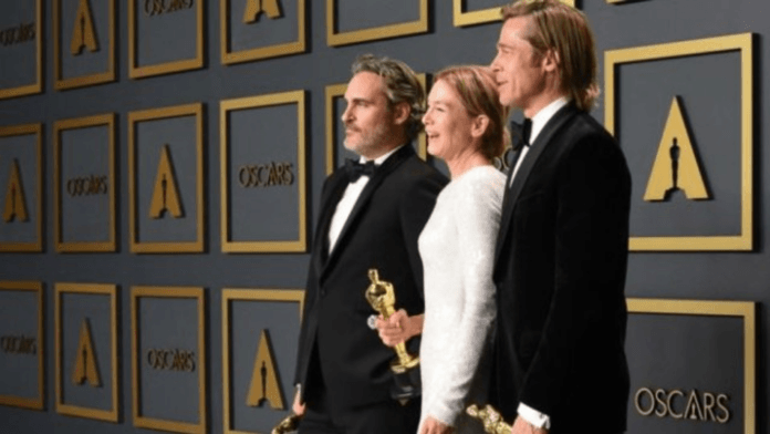 Joaquin Phoenix, Renee Zellweger and Brad Pitt posed with their trophies (AFP)