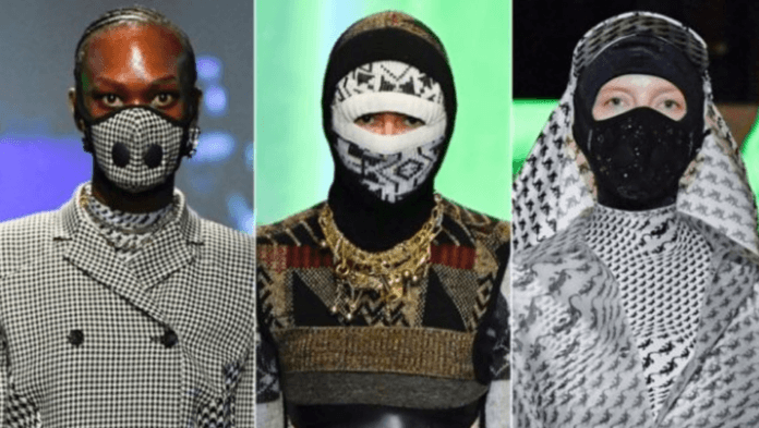 Models were seen wearing facemasks at Marine Serre's Paris Fashion Week show (GETTY) Models were seen wearing facemasks at Marine Serre's Paris Fashion Week show (GETTY)