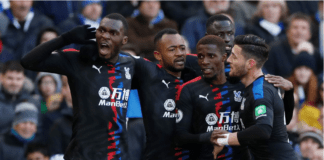 Jordan Ayew celebrates with Palace teammates