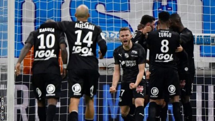 Amiens players celebrate scoring a goal against Marseille Amiens players celebrate scoring a goal against Marseille