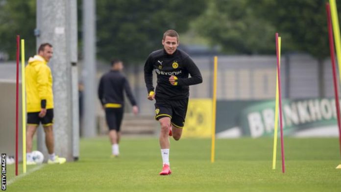 Borussia Dortmund are four points behind leaders Bayern Munich with nine games of the season remaining Borussia Dortmund are four points behind leaders Bayern Munich with nine games of the season remaining