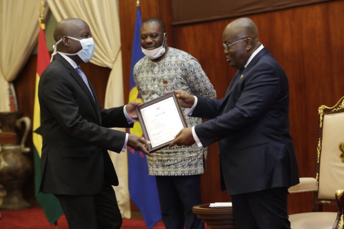 1President Nana Addo Dankwa Akufo-Addo presenting a charter to Prof. Aaron Lawson (left), Chairman,Board of Governors, All Nations University with Dr Matthew Opoku Prempeh, Minister of Education millde akufo addo