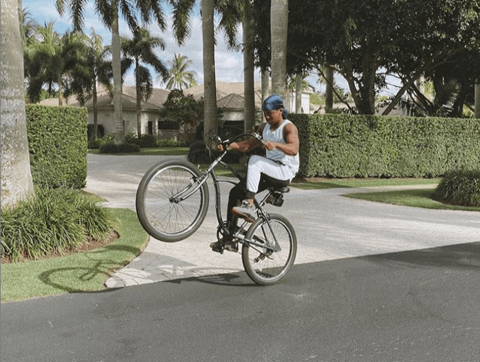 Abraham Attah riding his bicycle skillfully Abraham Attah riding his bicycle skillfully