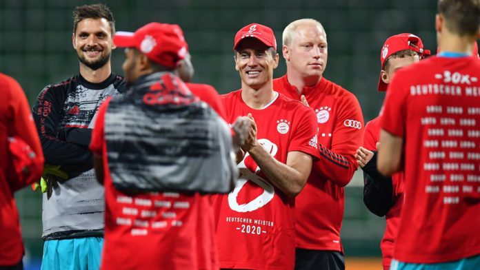 Robert Lewandowski of Bayern Munich wears a shirt and cap in celebration of securing the Bundesliga title following their victory in the Bundesliga match between SV Werder Bremen and FC Bayern Muenchen Image credit: Getty Images Robert Lewandowski of Bayern Munich wears a shirt and cap in celebration of securing the Bundesliga title following their victory in the Bundesliga match between SV Werder Bremen and FC Bayern Muenchen Image credit: Getty Images