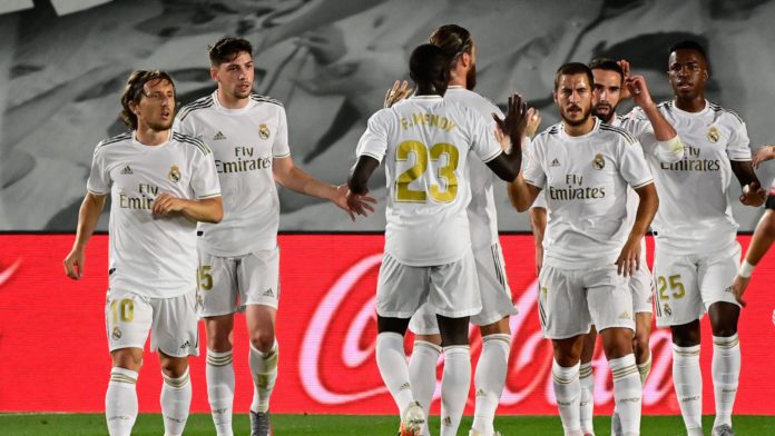 Real Madrid's Brazilian forward Vinicius Junior (R) celebtrates with teammates after scoring during the Spanish League football match Real Madrid CF against RCD Mallorca at at the Alfredo di Stefano stadium Image credit: Getty Images Real Madrid's Brazilian forward Vinicius Junior (R) celebtrates with teammates after scoring during the Spanish League football match Real Madrid CF against RCD Mallorca at at the Alfredo di Stefano stadium Image credit: Getty Images