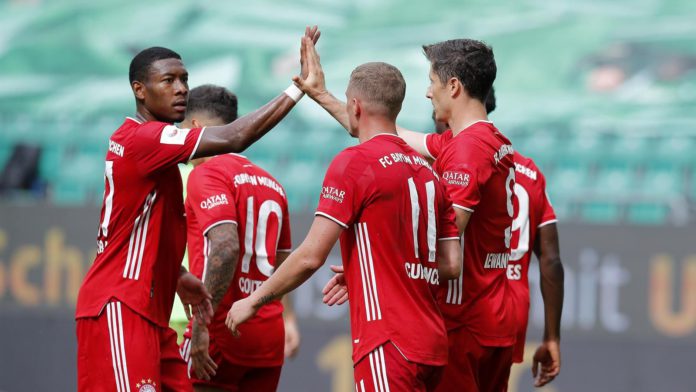 Robert Lewandowski of Bayern Muenchen celebrates the third goal for his team with Michael Cuisance of Bayern Muenchen and David Alaba of Bayern Muenchen during the Bundesliga match between VfL Wolfsburg and FC Bayern Muenchen at Volkswagen Arena on June 2 Image credit: Getty Images Robert Lewandowski of Bayern Muenchen celebrates the third goal for his team with Michael Cuisance of Bayern Muenchen and David Alaba of Bayern Muenchen during the Bundesliga match between VfL Wolfsburg and FC Bayern Muenchen at Volkswagen Arena on June 2 Image credit: Getty Images