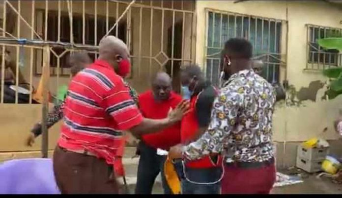 The NDC pastor (in red shirt ) was picked up at his house on Tuesday during a radio interview The NDC pastor (in red shirt ) was picked up at his house on Tuesday during a radio interview