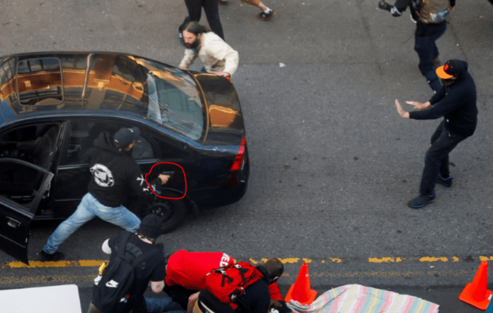 Man drives car toward Seattle protesters then shoots one, police say Man drives car toward Seattle protesters then shoots one, police say