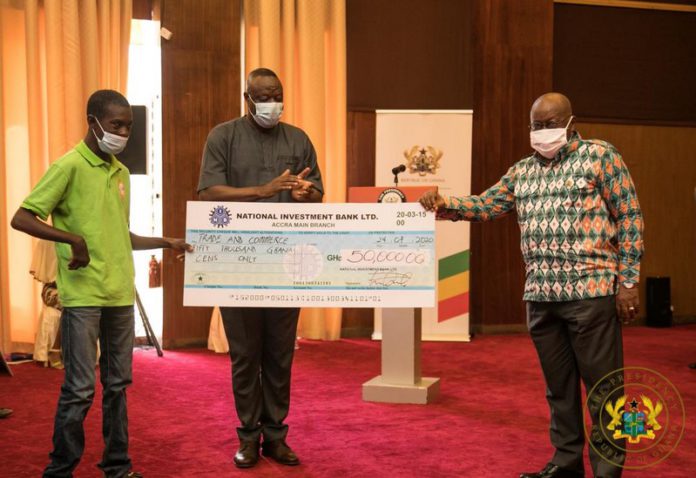 Nana Addo Dankwa Akufo-Addo presenting a cheque to a beneficiary Nana Addo Dankwa Akufo-Addo presenting a cheque to a beneficiary