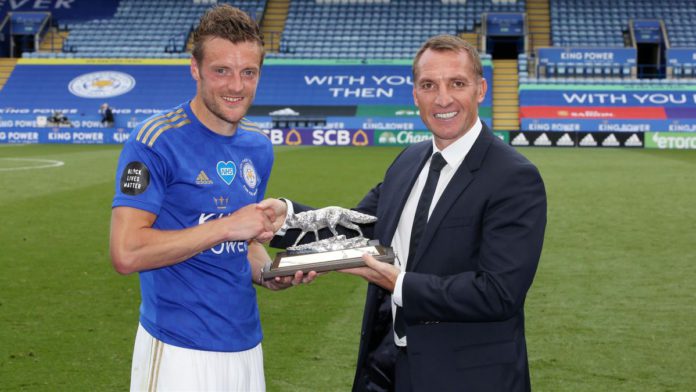 Jamie Vardy of Leicester City is presented with a silver fox by Leicester City Manager Brendan Rodgers, to commemorate scoring 100 Premier League goals Image credit: Getty Images Jamie Vardy of Leicester City is presented with a silver fox by Leicester City Manager Brendan Rodgers, to commemorate scoring 100 Premier League goals Image credit: Getty Images