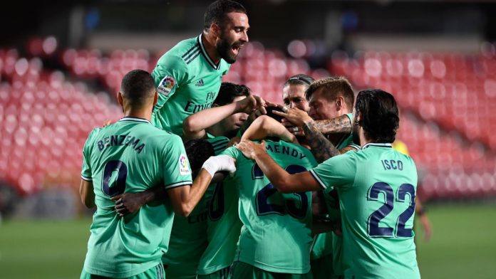 2849802-58742068-2560-1440 Real Madrid's players celebrate after French defender Ferland Mendy scored during the Spanish league football match Granada FC vs Real Madrid CF at Nuevo Los Carmenes stadium in Granada on July 13, 2020. Image credit: Getty Images