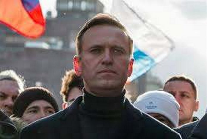 FILE - In this Feb. 29, 2020, file photo, Russian opposition activist Alexei Navalny takes part in a march in memory of opposition leader Boris Nemtsov in Moscow, Russia. Navalny has been poisoned and hospitalized on Thursday morning, Aug. 20, 2020 his spokeswoman Kira Yarmysh said on Twitter, Navalny felt unwell on a flight back to Moscow from Tomsk, a city in Siberia. (AP Photo/Pavel Golovkin, File) FILE - In this Feb. 29, 2020, file photo, Russian opposition activist Alexei Navalny takes part in a march in memory of opposition leader Boris Nemtsov in Moscow, Russia. Navalny has been poisoned and hospitalized on Thursday morning, Aug. 20, 2020 his spokeswoman Kira Yarmysh said on Twitter, Navalny felt unwell on a flight back to Moscow from Tomsk, a city in Siberia. (AP Photo/Pavel Golovkin, File)