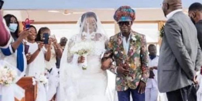 Kojo Antwi walking his fan Efia Antwiwaa Kajah to the altar Kojo Antwi walking his fan Efia Antwiwaa Kajah to the altar