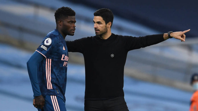 MANCHESTER, ENGLAND - OCTOBER 17: Thomas Partey of Arsenal gets some instructions from Arsenal Manager Mikel Arteta during the Premier League match between Manchester City and Arsenal at Etihad Stadium on October 17, 2020 in Manchester, England. (Photo by David Price/Arsenal FC via Getty Images) MANCHESTER, ENGLAND - OCTOBER 17: Thomas Partey of Arsenal gets some instructions from Arsenal Manager Mikel Arteta during the Premier League match between Manchester City and Arsenal at Etihad Stadium on October 17, 2020 in Manchester, England. (Photo by David Price/Arsenal FC via Getty Images)