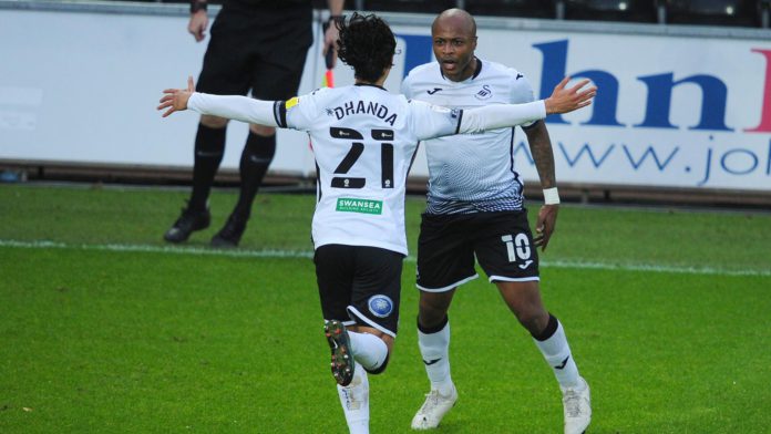 Andre Ayew celebrates with Swansea City teammate Andre Ayew celebrates with Swansea City teammate