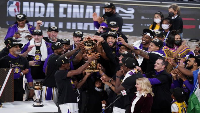 NBA Finals Lakers Heat Basketball The Los Angeles Lakers players celebrate after the Lakers defeated the Miami Heat 106-93 in Game 6 of basketball's NBA Finals Sunday, Oct. 11, 2020, in Lake Buena Vista, Fla. (AP Photo/John Raoux)