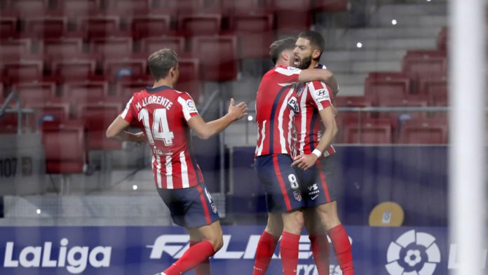 Yannick Carrasco of Atletico de Madrid celebrates with teammate Marcos Llorente and Saul Niguez after scoring his team's first goal during the La Liga Santander match between Atletico de Madrid and FC Barcelona at Estadio Wanda Metropolitano Image credit: Getty Images Yannick Carrasco of Atletico de Madrid celebrates with teammate Marcos Llorente and Saul Niguez after scoring his team's first goal during the La Liga Santander match between Atletico de Madrid and FC Barcelona at Estadio Wanda Metropolitano Image credit: Getty Images
