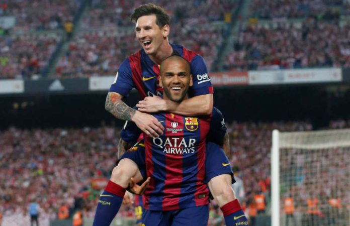 Dani Alves celebrates with Lionel Messi Dani Alves celebrates with Lionel Messi