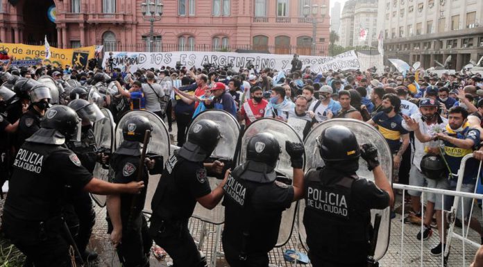Police clash with fans of Diego Maradona © Getty Images Police clash with fans of Diego Maradona © Getty Images