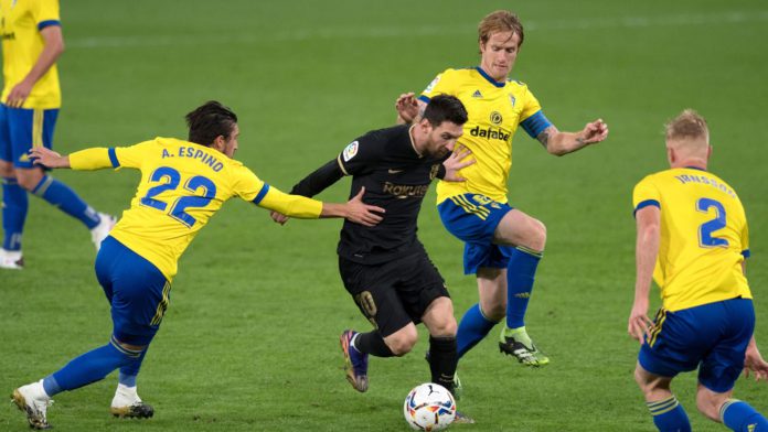 Cadiz players surround Lionel Messi Image credit: Getty Images Cadiz players surround Lionel Messi Image credit: Getty Images