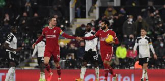 Liverpool's Egyptian midfielder Mohamed Salah (2nd R) celebrates with Liverpool's English midfielder Jordan Henderson after scoring their first goal from the penalty spot during the English Premier League football match between Fulham and Liverpool at Cra Image credit: Getty Images