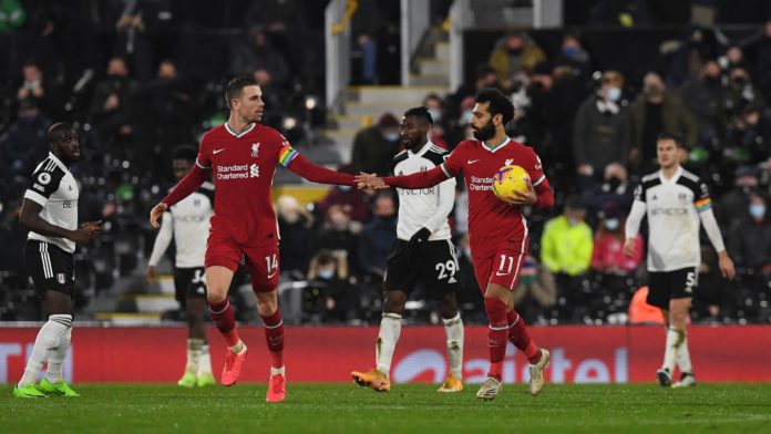 Liverpool's Egyptian midfielder Mohamed Salah (2nd R) celebrates with Liverpool's English midfielder Jordan Henderson after scoring their first goal from the penalty spot during the English Premier League football match between Fulham and Liverpool at Cra Image credit: Getty Images Liverpool's Egyptian midfielder Mohamed Salah (2nd R) celebrates with Liverpool's English midfielder Jordan Henderson after scoring their first goal from the penalty spot during the English Premier League football match between Fulham and Liverpool at Cra Image credit: Getty Images