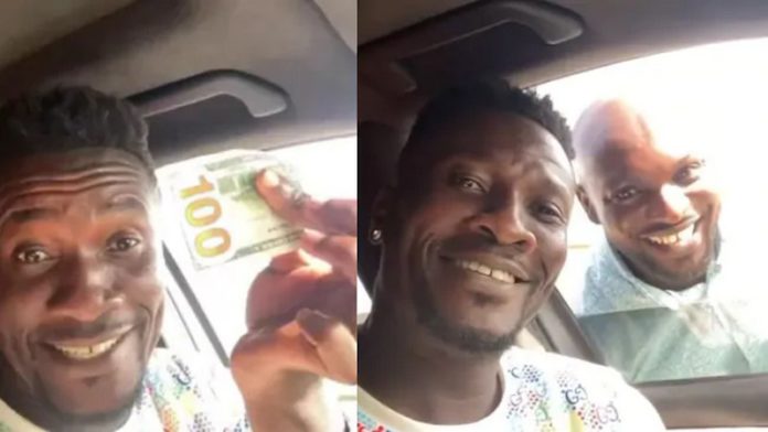 Asamoah Gyan and fan Asamoah Gyan and fan