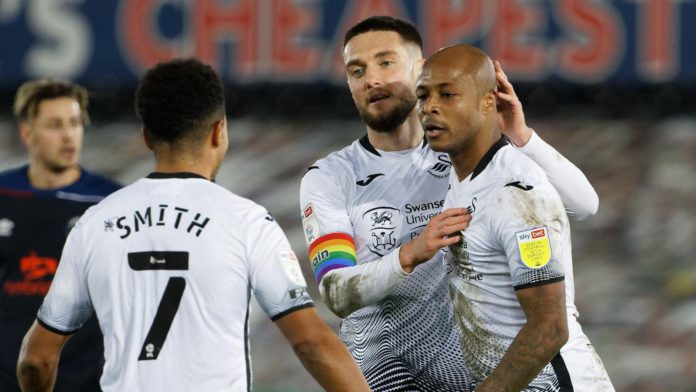 Andre Ayew with Swansea City teammates Andre Ayew with Swansea City teammates