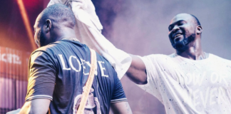 Davido's fallen bodyguard TJ wipes sweat off the musician during performance