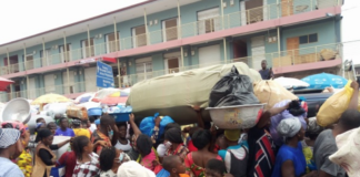 Shoppers on the street in front of the Makola Market in Accra.
