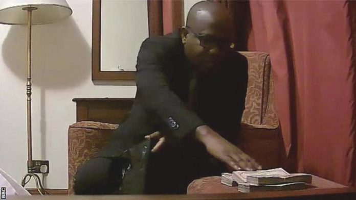 Kwesi Nyantakyi was filmed taking thousands of dollars of cash and putting them into a bag Kwesi Nyantakyi was filmed taking thousands of dollars of cash and putting them into a bag