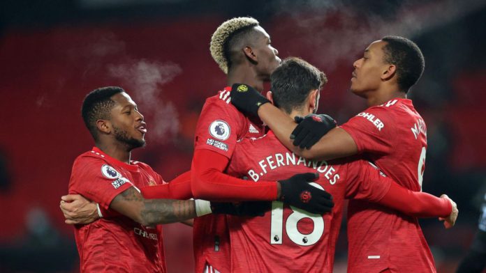 Manchester United's Portuguese midfielder Bruno Fernandes (C) celebrates with teammates after scoring their second goal from the penalty spot during the English Premier League football match between Manchester United and Aston Villa at Old Trafford in Man Image credit: Getty Images Manchester United's Portuguese midfielder Bruno Fernandes (C) celebrates with teammates after scoring their second goal from the penalty spot during the English Premier League football match between Manchester United and Aston Villa at Old Trafford in Man Image credit: Getty Images