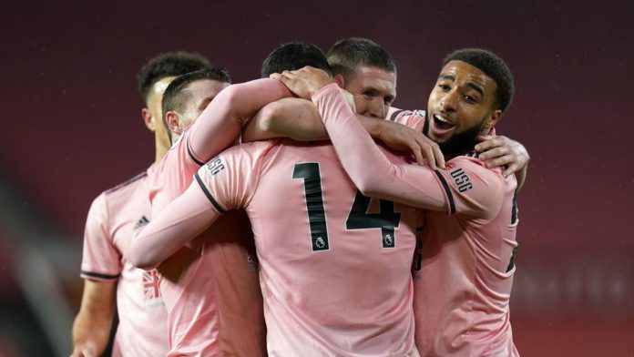 Oliver Burke of Sheffield United celebrates with Jayden Bogle and team mates after scoring their side's second goal during the Premier League match between Manchester United and Sheffield United at Old Trafford on January 27, 2021 in Manchester, England. Image credit: Getty Images Oliver Burke of Sheffield United celebrates with Jayden Bogle and team mates after scoring their side's second goal during the Premier League match between Manchester United and Sheffield United at Old Trafford on January 27, 2021 in Manchester, England. Image credit: Getty Images