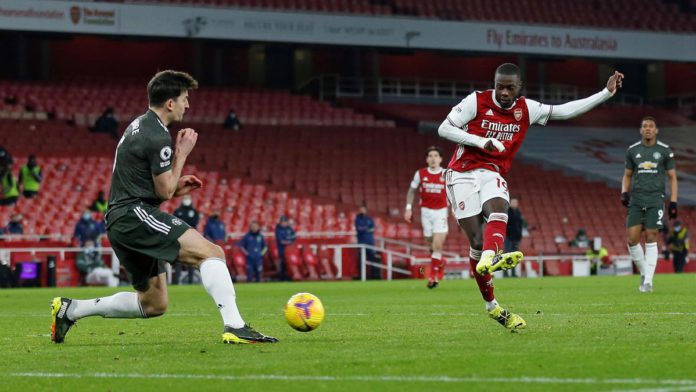 Manchester United's English defender Harry Maguire (L) blocks a shot from Arsenal's French-born Ivorian midfielder Nicolas Pepe during the English Premier League football match between Arsenal and Manchester United at the Emirates Stadium in London on Jan Image credit: Getty Images Manchester United's English defender Harry Maguire (L) blocks a shot from Arsenal's French-born Ivorian midfielder Nicolas Pepe during the English Premier League football match between Arsenal and Manchester United at the Emirates Stadium in London on Jan Image credit: Getty Images