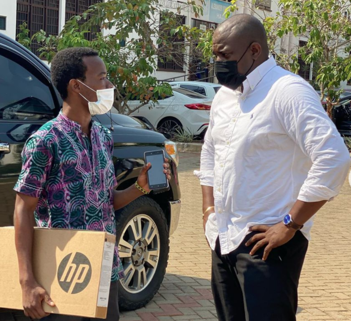 John Dumelo gives out laptop to a medical student