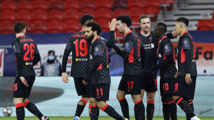 Sadio Mane of Liverpool celebrates with team mates Jordan Henderson and Roberto Firmino after scoring their side's second goal during the UEFA Champions League Round of 16 match between RB Leipzig and Liverpool FC at Puskas Arena on February 16, 2021 Image credit: Getty Images Sadio Mane of Liverpool celebrates with team mates Jordan Henderson and Roberto Firmino after scoring their side's second goal during the UEFA Champions League Round of 16 match between RB Leipzig and Liverpool FC at Puskas Arena on February 16, 2021 Image credit: Getty Images