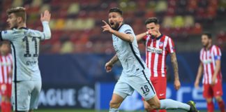 Olivier Giroud of Chelsea reacts as the flag goes up for offside. After a VAR deliberation the offside decision is overturned and Olivier Giroud scores their side's first goal during the UEFA Champions League Round of 16 match between Atletico Madrid and Image credit: Getty Images